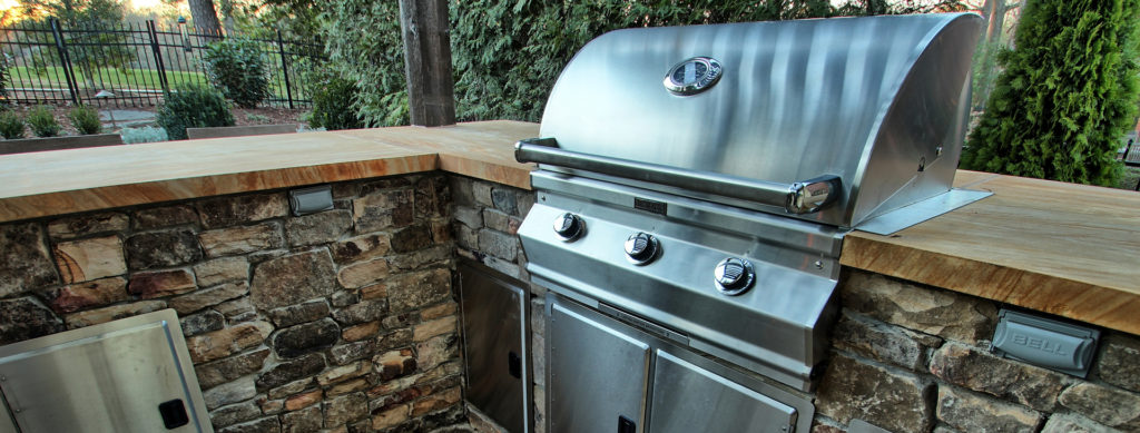 Outdoor Kitchen with Grill installed in backyard in Charlotte by Benton Outdoor Living