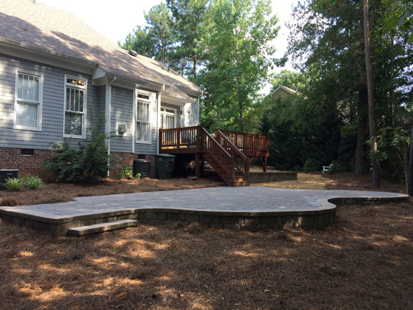 Backyard in Lake Wylie after phase one of backyard plan is completed by building a patio