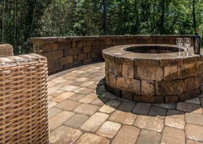 Fire Pit built into a backyard patio in Charlotte, NC by Benton Outdoor Living