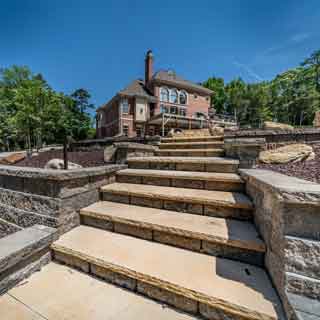 Hardscape stairs in a backyard near Lake Norman installed by Benton Outdoor Living