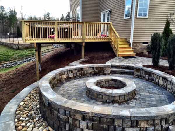 Fort Mill Hillside Oasis where we built a fire pit and a deck to give the backyard some livable space