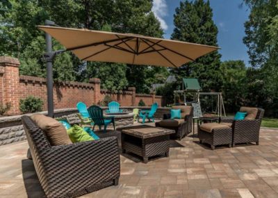 Large patio installed with chairs and umbrella