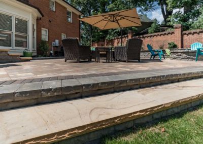 Patio with Step Down, Umbrella and Chairs