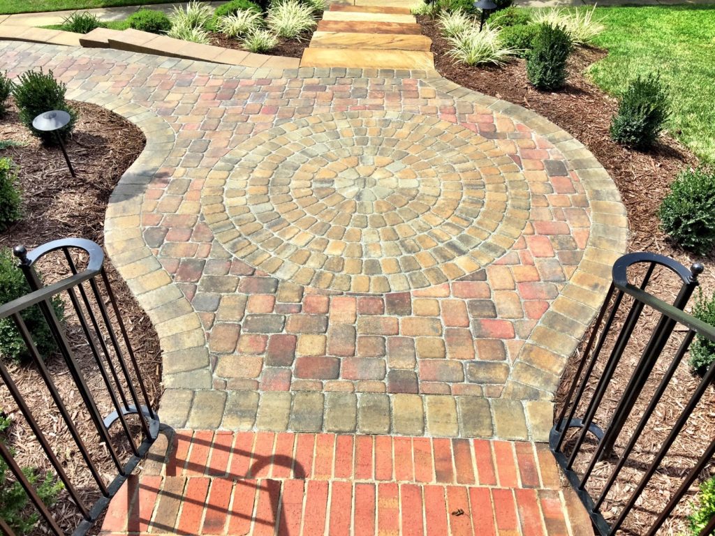 steps down to hardscape walkway made of pavers by Benton Outdoor Living