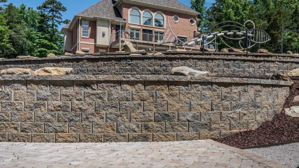 Retaining wall as part of a terrace system in a Charlotte metro area backyard hardscape.