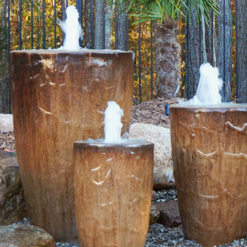 Pondless water fountain water feature installed in a charlotte backyard by Benton Outdoor Living