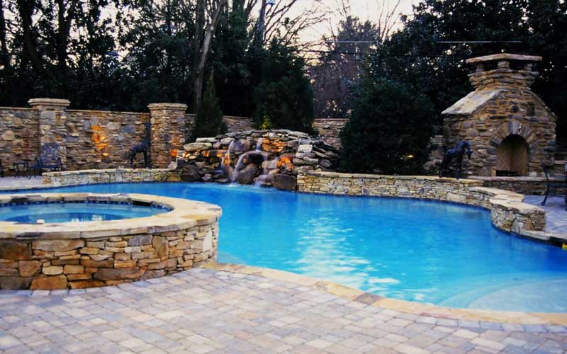 Pool, Fireplace and hardscape completed by Benton Outdoor Living