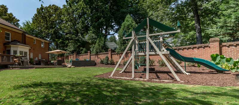 Playground area included in landscaping design by Benton Outdoor Living in Charlotte