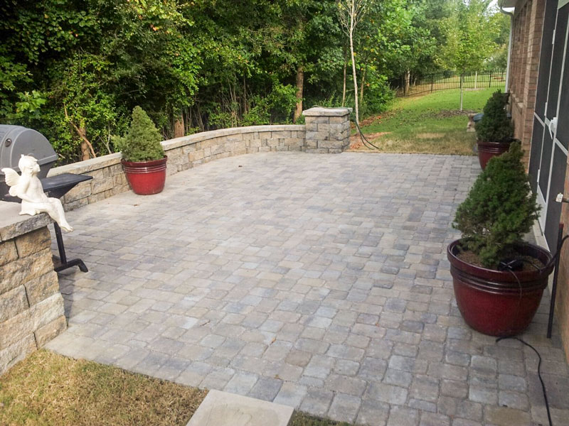 Backyard Patio with seat wall and grilling area designed and built by Benton Outdoor Living in Charlotte, NC