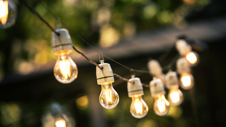 Outdoor lighting idea - add overhead string lighting above your patio or other outdoor area as in this photo.