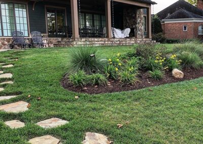 Lake Norman landscaping with plant bed and stepping stones by Benton Outdoor Living