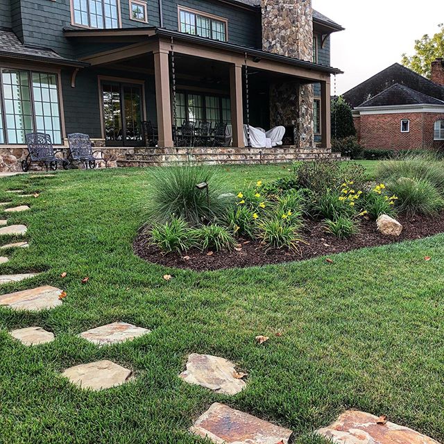 Lake Norman landscaping with plant bed and stepping stones by Benton Outdoor Living