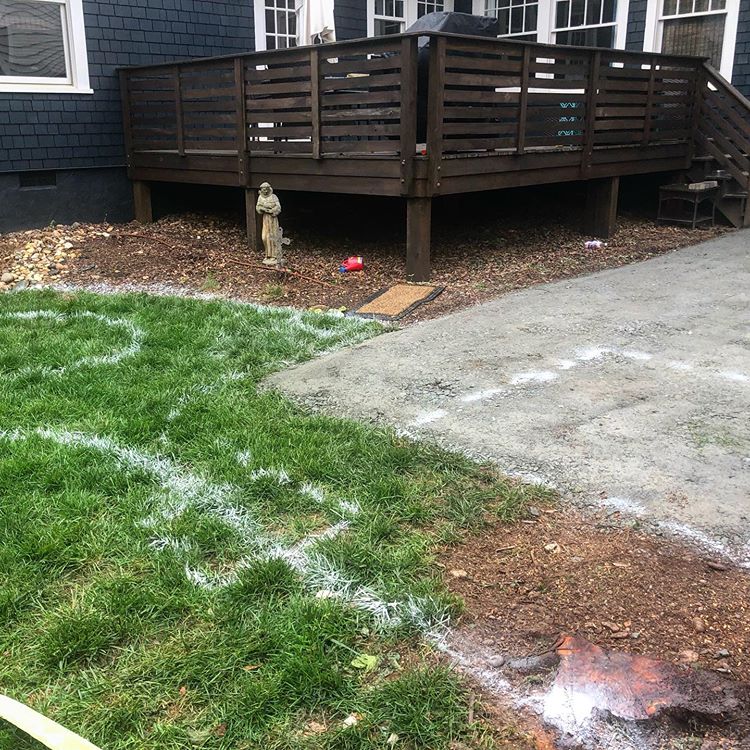 Charlotte backyard marked with new patio location where a parking spot once was.