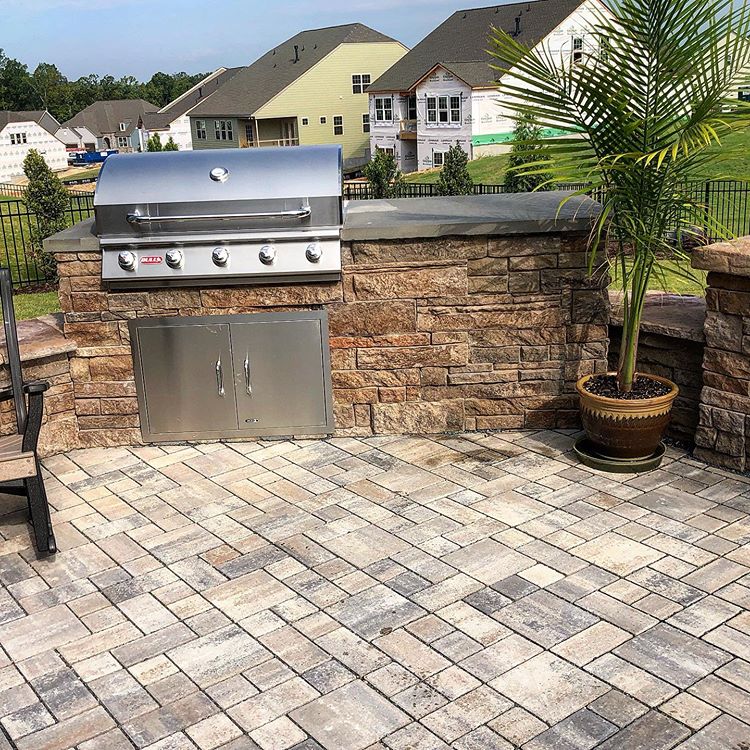 Grill area built into a patio and wall in a Charlotte area backyard.