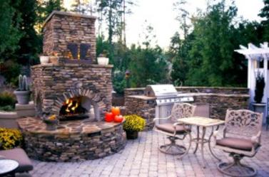 Outdoor Fireplace in backyard
