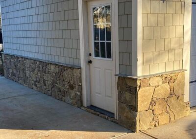 Stone Detailing added to the side of this Lake Wylie garage to match the house by Benton Outdoor Living