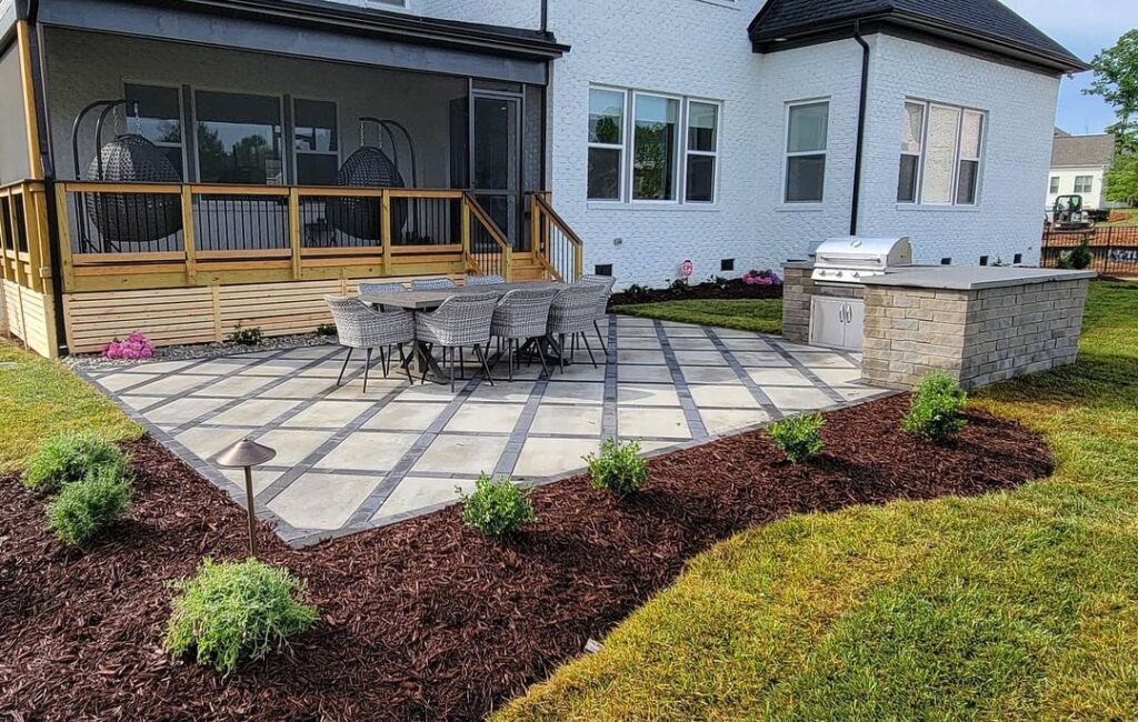 Landscape design of a Waxhaw Patio with corner grill and landscape plants by Benton Outdoor Living